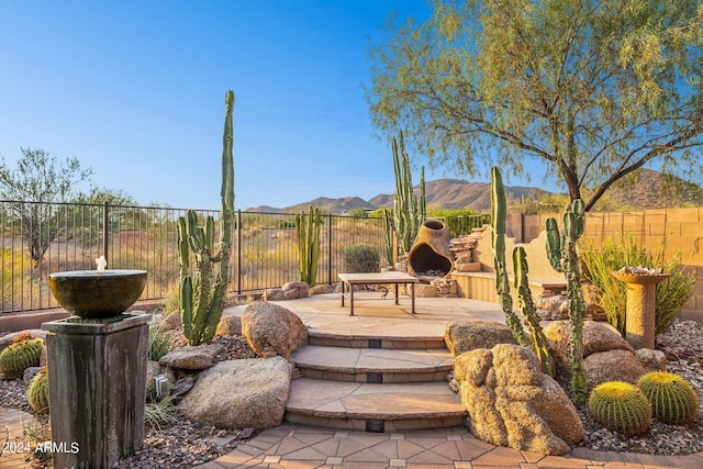 view of patio / terrace with a mountain view