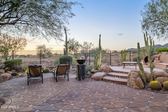 view of patio terrace at dusk