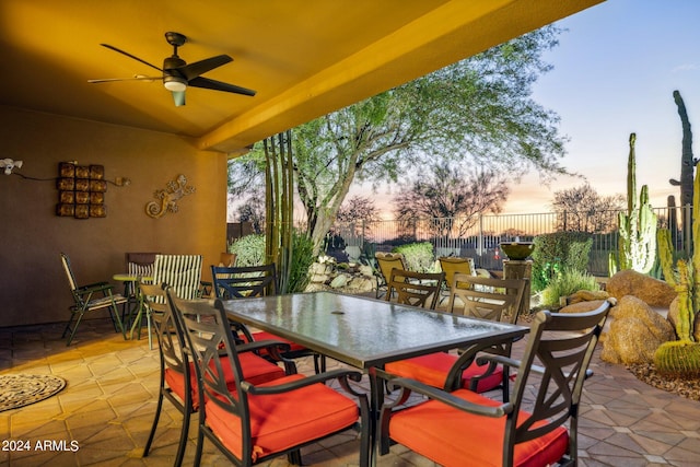 patio terrace at dusk with ceiling fan