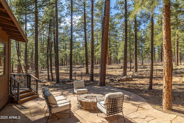 view of patio featuring a fire pit