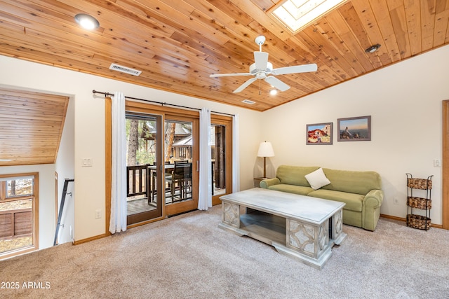 living room with wooden ceiling, vaulted ceiling with skylight, visible vents, and carpet flooring