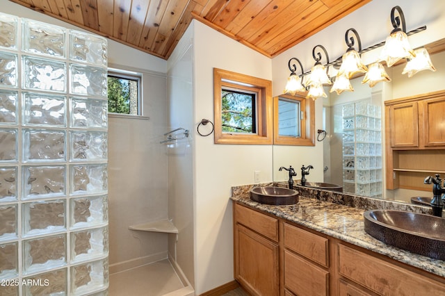 full bath with lofted ceiling, wood ceiling, a sink, and a walk in shower