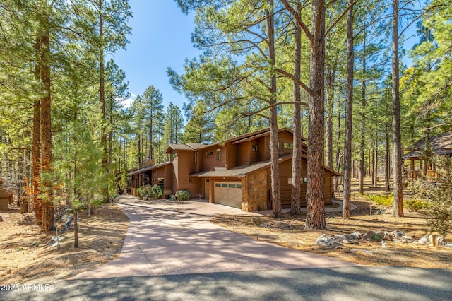 view of front of property with driveway and an attached garage