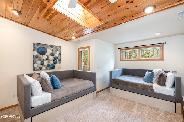 living room with carpet, wooden ceiling, visible vents, and plenty of natural light