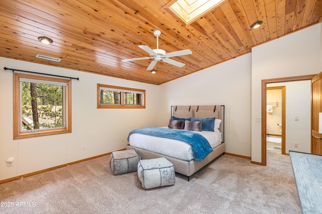 bedroom featuring lofted ceiling with skylight, wood ceiling, visible vents, and carpet flooring