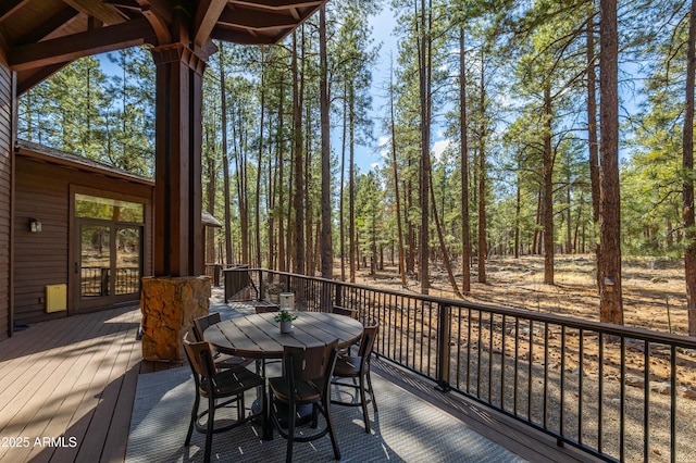 wooden terrace with outdoor dining space