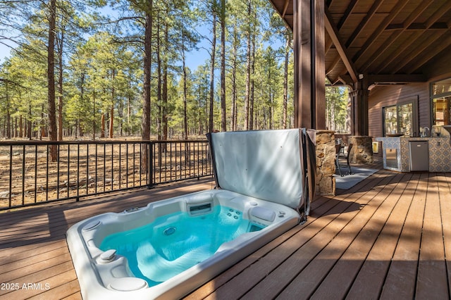 wooden deck with hot tub deck surround