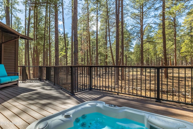 deck featuring hot tub deck surround