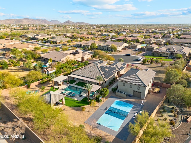 birds eye view of property with a mountain view