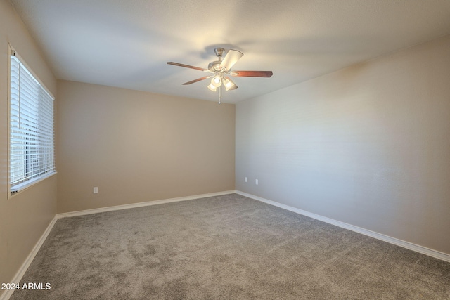 spare room with ceiling fan and carpet floors