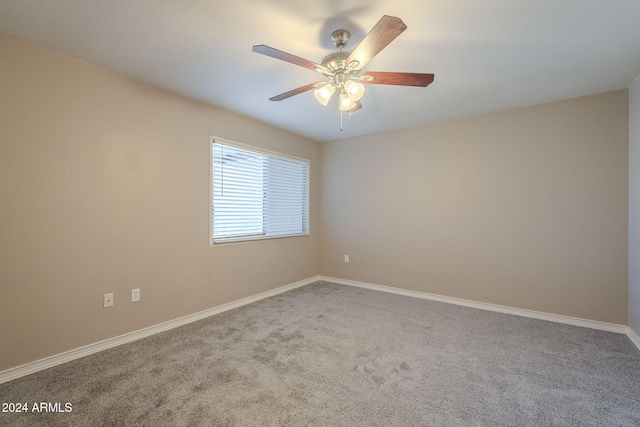 unfurnished room featuring carpet and ceiling fan