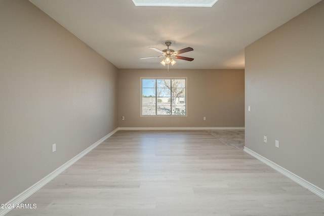 spare room with ceiling fan and light hardwood / wood-style flooring