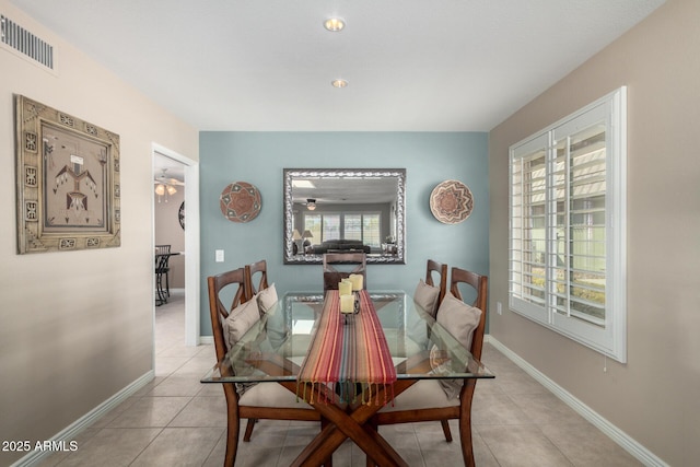 dining room with ceiling fan and light tile patterned flooring