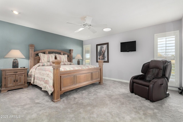 bedroom with light colored carpet and ceiling fan