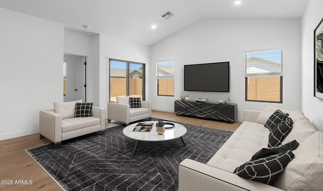 living room with wood finished floors, visible vents, baseboards, vaulted ceiling, and recessed lighting