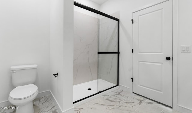bathroom with a marble finish shower, baseboards, toilet, and marble finish floor
