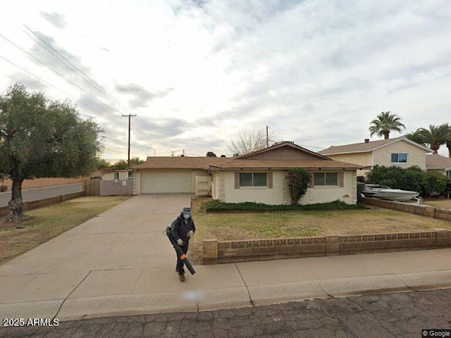 8749 E Keim Dr E, Scottsdale, AZ 85250 - single story home with driveway and an attached garage