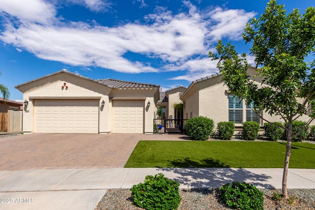 25875 S 227th Way, Queen Creek, AZ 85142 - mediterranean / spanish house featuring stucco siding, decorative driveway, an attached garage, and a tile roof