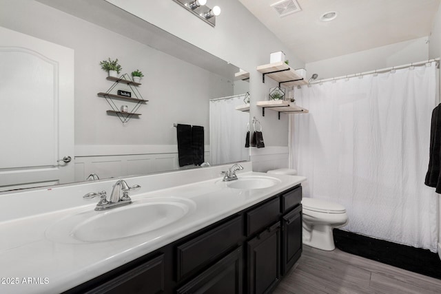 3545 W Tanner Ranch Rd, San Tan Valley, AZ 85144 - full bathroom with toilet, double vanity, wood finished floors, and a shower with shower curtain