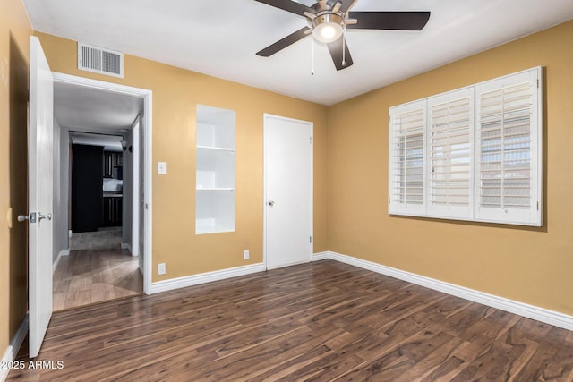 8331 N 6th St, Phoenix, AZ 85020 - unfurnished bedroom featuring dark wood-style flooring and a ceiling fan