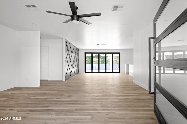 interior space featuring light hardwood / wood-style floors and ceiling fan