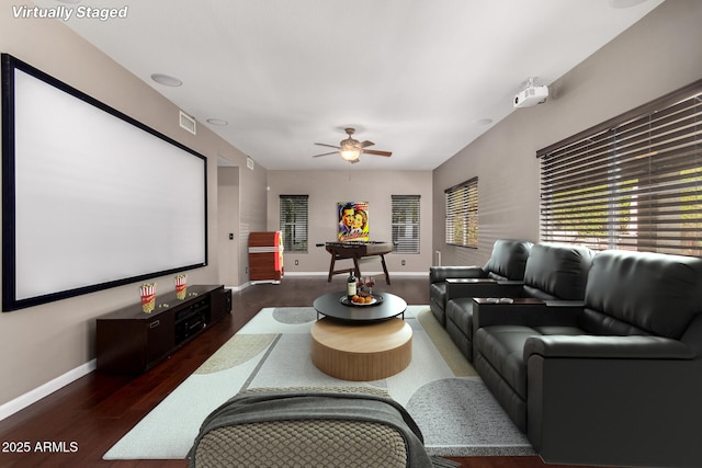 1210 E Azure Sea Ln, Gilbert, AZ 85234 - cinema with baseboards, wood finished floors, and ceiling fan