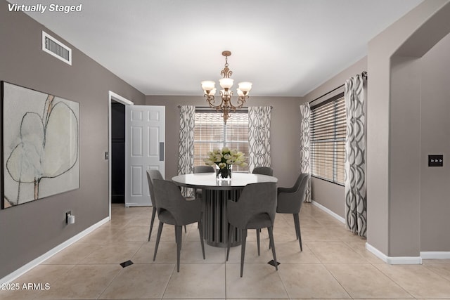 1210 E Azure Sea Ln, Gilbert, AZ 85234 - dining room with a chandelier, baseboards, and light tile patterned floors