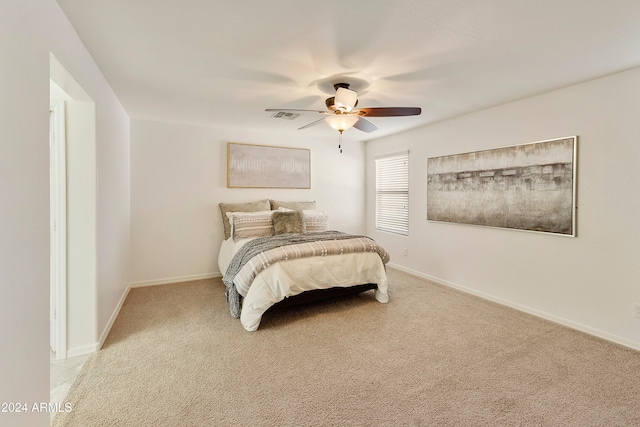 carpeted bedroom with ceiling fan