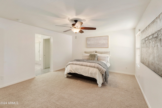 bedroom featuring light carpet and ceiling fan