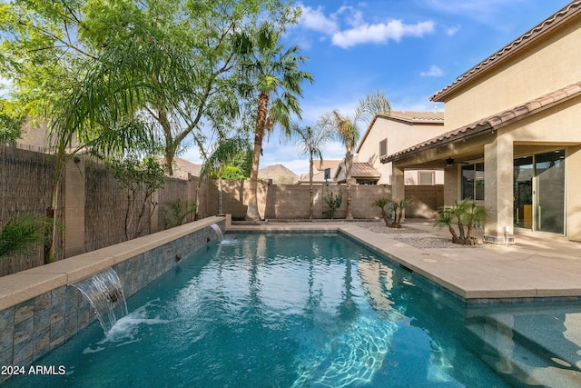 view of swimming pool featuring a patio and pool water feature