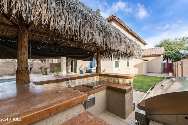 view of patio featuring an outdoor kitchen and area for grilling