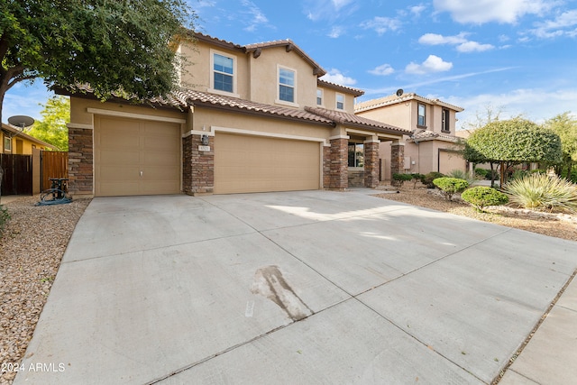 mediterranean / spanish-style home featuring a garage