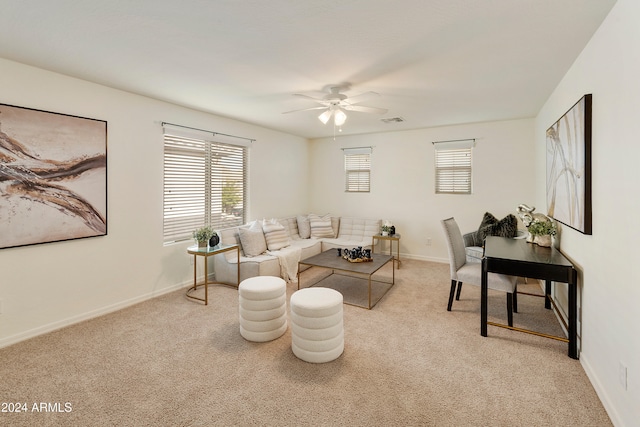 living room with plenty of natural light and light colored carpet