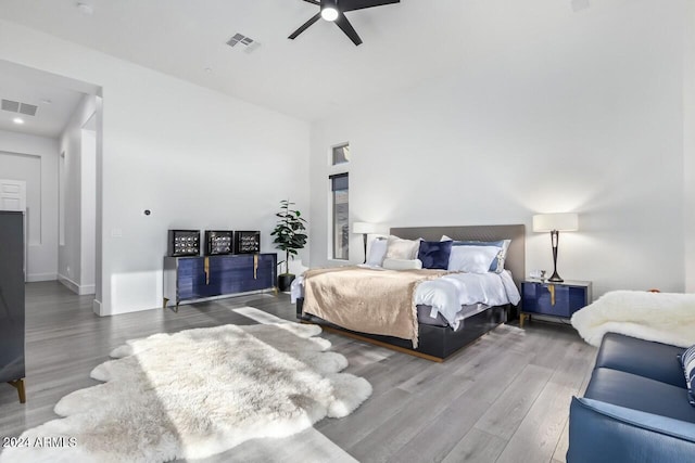 bedroom with hardwood / wood-style flooring and ceiling fan