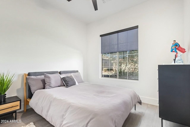 bedroom featuring ceiling fan and light hardwood / wood-style flooring