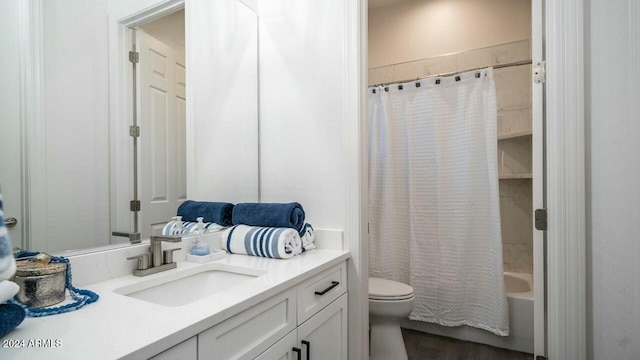 full bathroom with shower / bath combo, vanity, toilet, and hardwood / wood-style floors