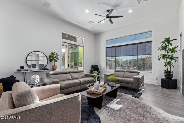 living room featuring hardwood / wood-style flooring and ceiling fan