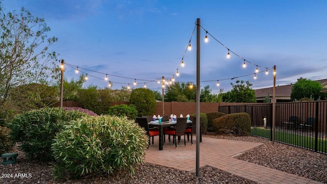 view of patio terrace at dusk