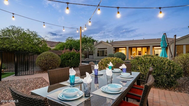 view of patio terrace at dusk