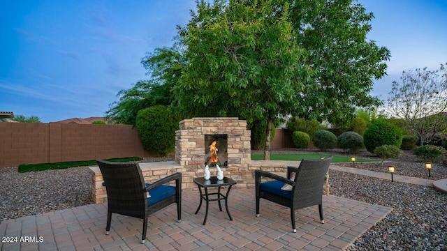 view of patio / terrace with an outdoor stone fireplace