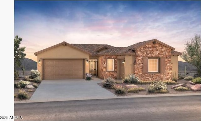 22523 E Orchard Ln, Queen Creek, AZ 85142 - view of front of house featuring stone siding, an attached garage, driveway, and stucco siding