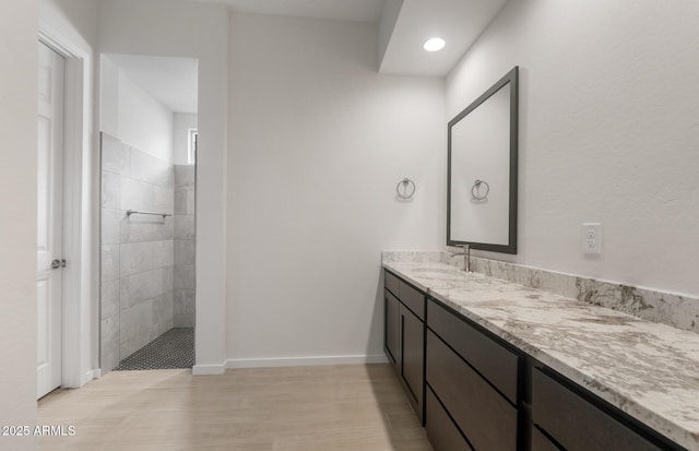 22523 E Orchard Ln, Queen Creek, AZ 85142 - full bathroom with walk in shower, vanity, wood finished floors, baseboards, and recessed lighting