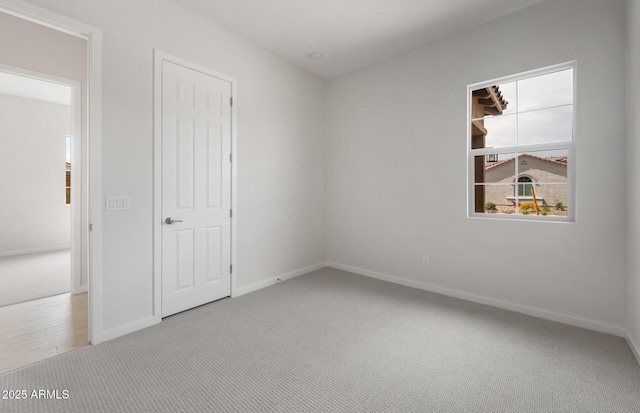 22523 E Orchard Ln, Queen Creek, AZ 85142 - unfurnished bedroom featuring carpet floors and baseboards