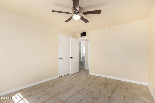 unfurnished room featuring visible vents, baseboards, and ceiling fan