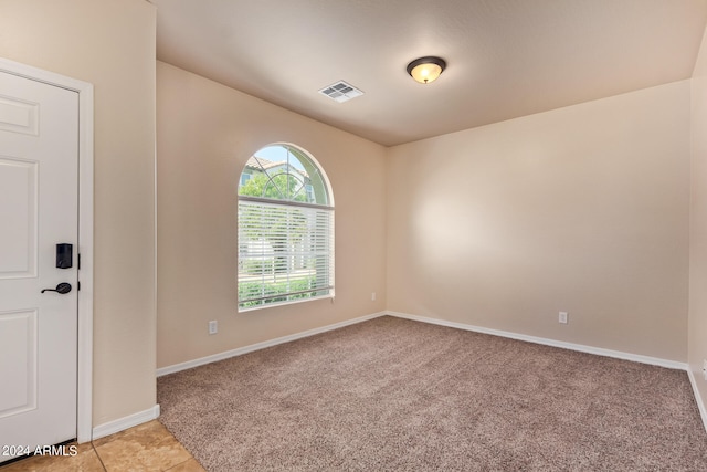 empty room with light colored carpet