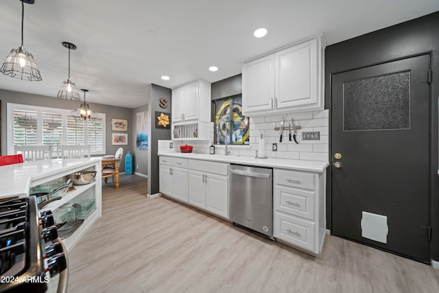 kitchen featuring hanging light fixtures, stainless steel dishwasher, decorative backsplash, and white cabinets