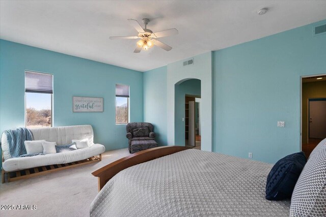 28607 N 152nd St, Scottsdale, AZ 85262 - carpeted bedroom with arched walkways, multiple windows, ceiling fan, and visible vents