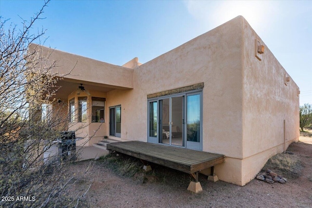 28607 N 152nd St, Scottsdale, AZ 85262 - rear view of house with a ceiling fan, stucco siding, and a wooden deck