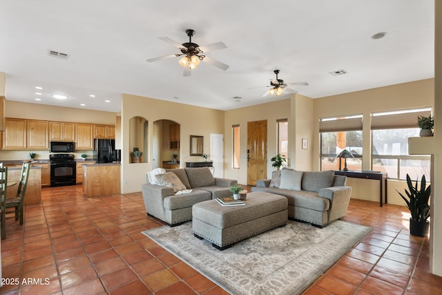 28607 N 152nd St, Scottsdale, AZ 85262 - living room featuring light tile patterned flooring, visible vents, ceiling fan, recessed lighting, and arched walkways