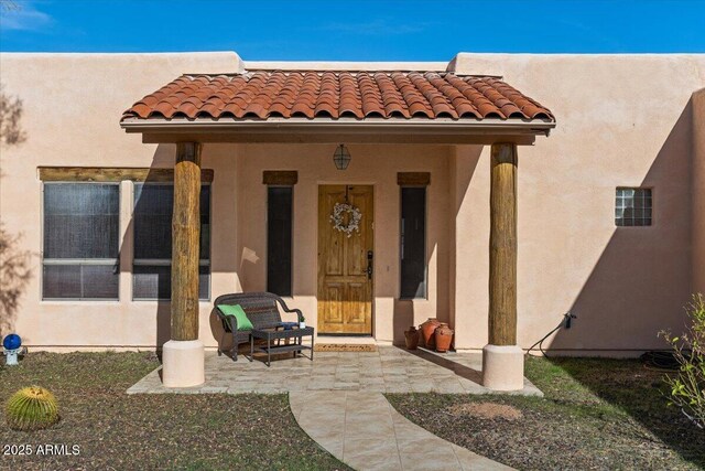28607 N 152nd St, Scottsdale, AZ 85262 - doorway to property featuring stucco siding and a tiled roof